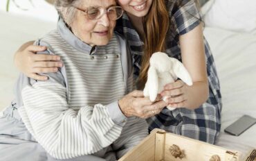 grandmother-checking-old-toys-with-granddaughter