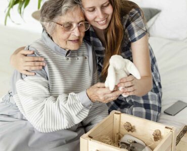 grandmother-checking-old-toys-with-granddaughter